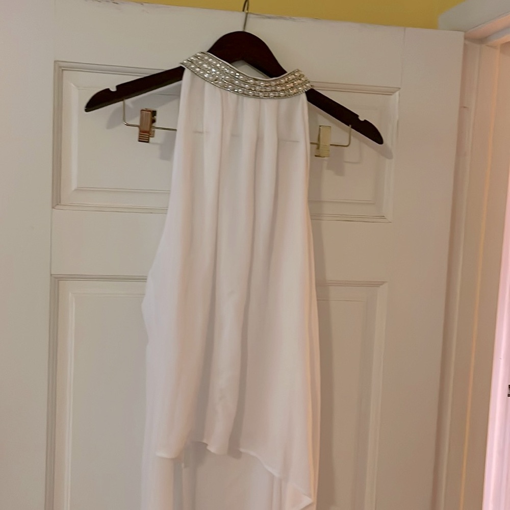 Brand new with tags white shirt with silver and white beads on neck .